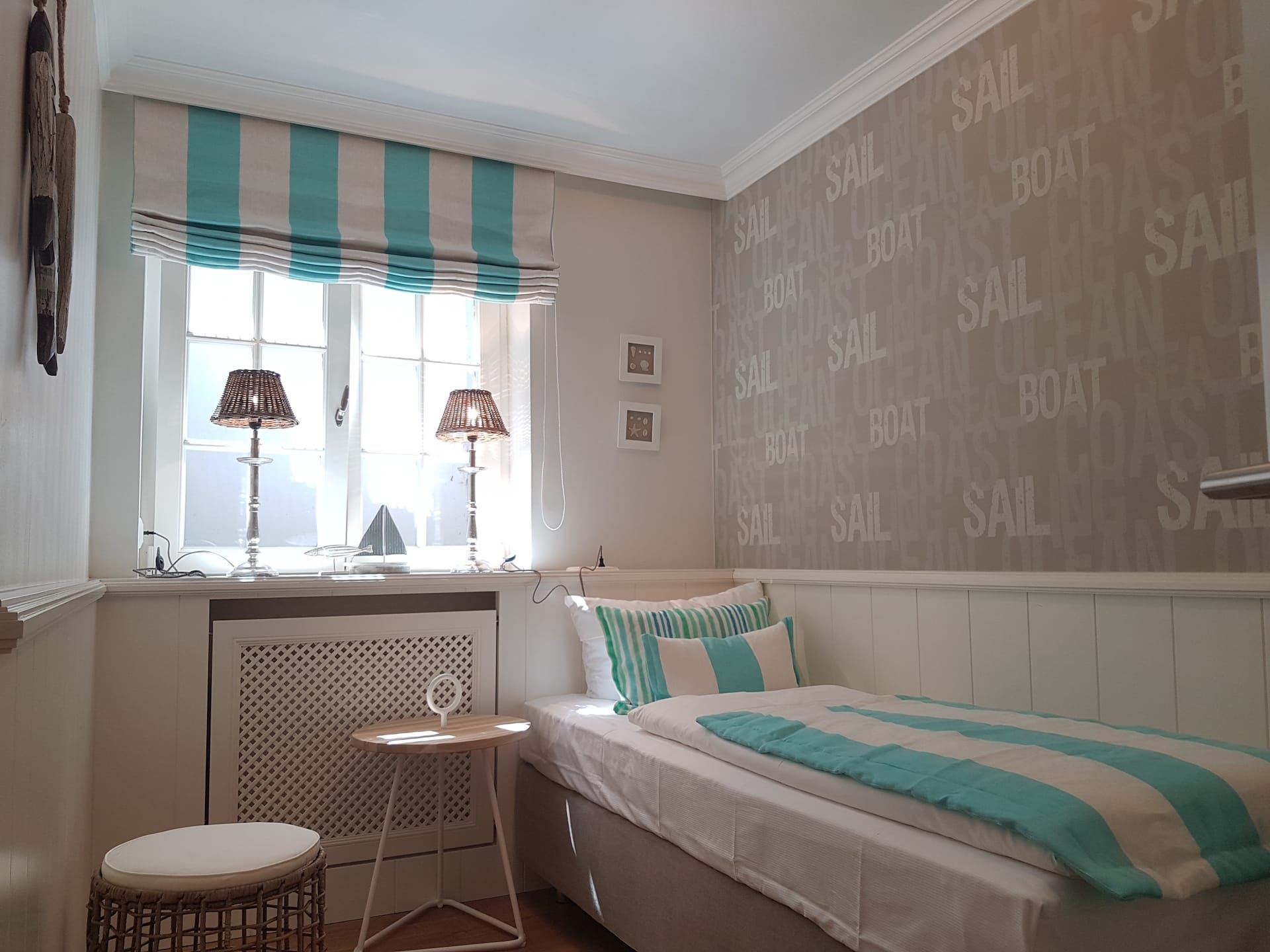 Schlafzimmer mit Einzelbett im "Seaside II" Ferienhaus in Rantum auf Sylt